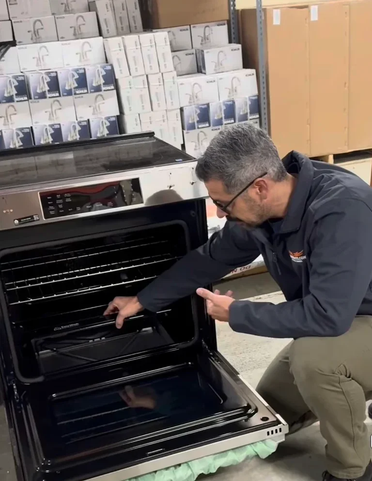 Technician inspecting an oven range