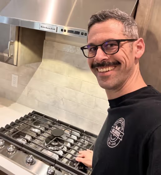 UDG Services owner Greg Cooper at a home appliance repair